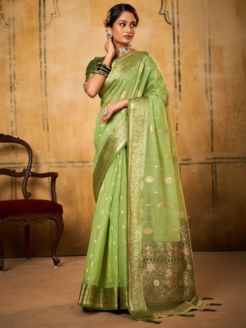Enhance Your Shine with Mesmeric Green Banarasi Silk Saree With Designer Blouse Piece